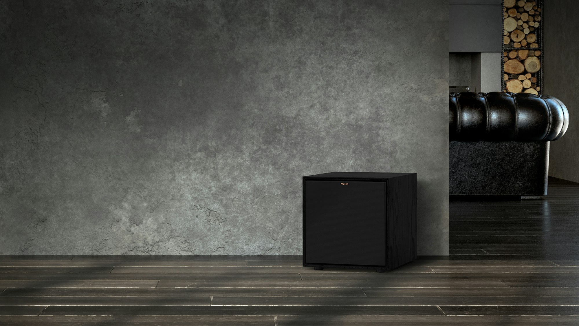 Reference Subwoofer R-101SW in front of a grey wall with the grille on